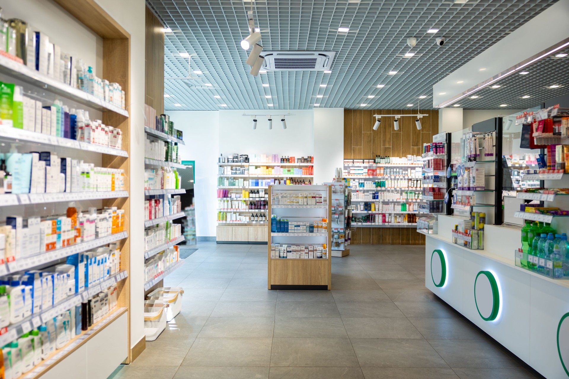 Picture of a pharmacy with various shelves with medicines